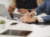 WHY INVESTORS SHOULD CONSIDER OPENING A DEMAT ACCOUNT Investor opening a demat account on a laptop