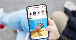 How to monitor your kid’s Instagram Messages? Parent checking a child’s Instagram messages on a phone