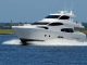 How to Retain the Brand New Look of Your Yacht? Crew polishing the hull of a luxury yacht