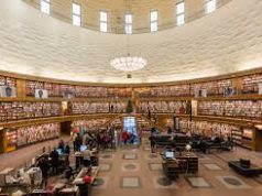New Jersey vs Virginia – Number of public libraries Interior of a public library with rows of books