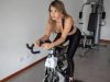 Indoor vs. Outdoor Cycling: Unleash Your Inner Rider with the Right Fit Cyclist training indoors on a stationary bike